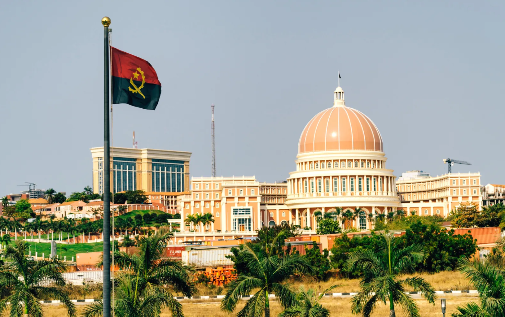 Luanda city skyline and Angolan flag